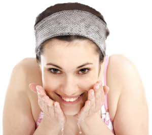 stock photo of woman washing her face
